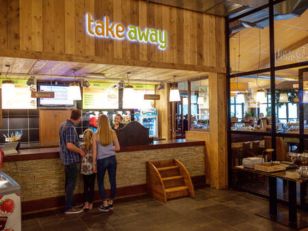 A family ordered food at the takeaway at the Landal-Winterberg holiday park