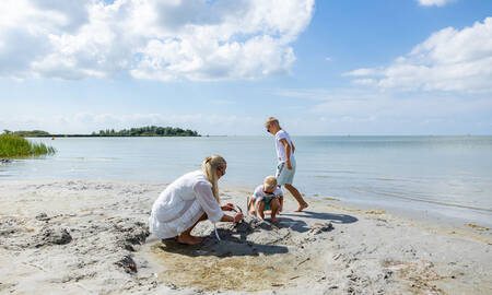 Children playing on the beach at the IJsselmeer at MarinaPark Beach Resort Soal