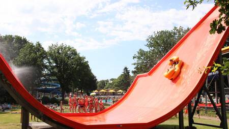 Slide with rubber boats in water play park "Splesj" at holiday park Molecaten Bosbad Hoeven