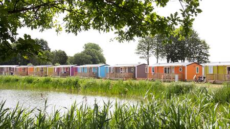 Chalets on the water of the Agnietenplas at holiday park Molecaten Park De Agnietenberg