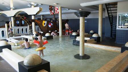 Children play in the paddling pool of holiday park Molecaten Park Noordduinen