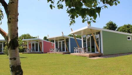 Colorful chalets of the "Zonnestraal" type at holiday park Molecaten Waterbos