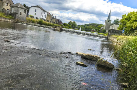 The river Ourthe right next to the small-scale holiday park Moulin de Hotton in the Ardennes