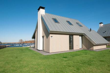 A luxury villa on the water at the Oesterdam Resort holiday park in Zeeland