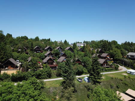 Holiday homes among the trees at the Petite Suisse holiday park in the Belgian Ardennes