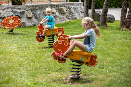 Children playing in the playground at holiday park RCN Belledonne