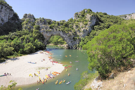 Beach on the river Ardèche next to holiday park RCN La Bastide en Ardèche