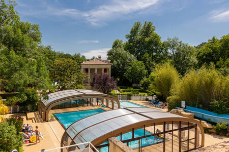 Swimming pool with sliding roof at holiday park RCN Le Moulin de la Pique