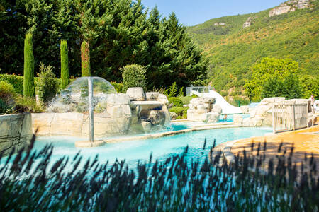 The outdoor pool with fountain of holiday park RCN Val de Cantobre