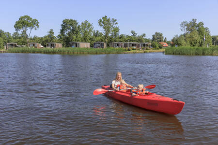 Mother with two children canoeing on the Sneekermeer at holiday park RCN de Potten