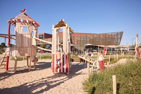 Children play in the playground of holiday park RCN de Schotsman