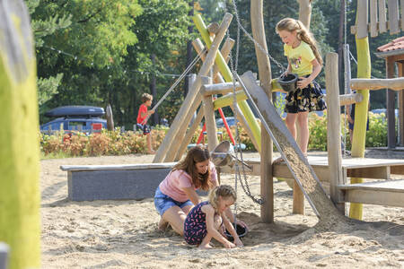 Children play in the playground at holiday park RCN het Grote Bos
