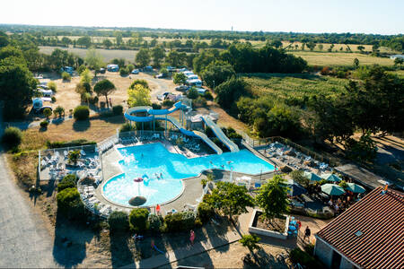 Aerial view of outdoor pool, camping field and main building of holiday park RCN la Ferme du Latois