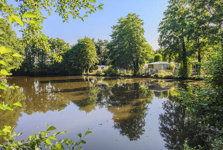 Chalets on a lake at holiday park RCN la Ferme du Latois