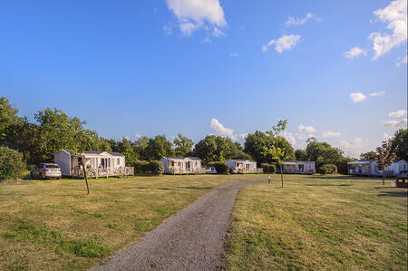 Chalets on a field at holiday park RCN la Ferme du Latois