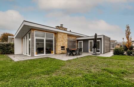 Detached holiday home with garden furniture on the terrace at the Resort Mooi Bemelen holiday park