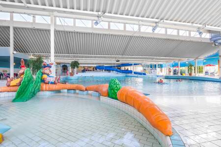 The toddler pool with a small slide of the Roompot Beach Resort holiday park