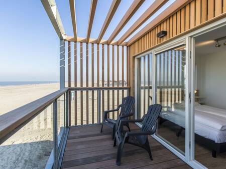 The beach and sea from the balcony of a beach house at Roompot Beach Villas Hoek van Holland