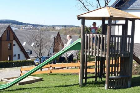 Children playing in the playground at Roompot Bergresort Winterberg