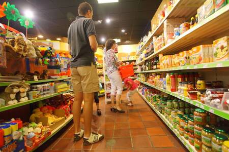 People shopping in the supermarket of holiday park Roompot Bospark de Schaapskooi