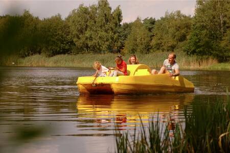 Family on a pedalo at the Roompot Bospark 't Wolfsven holiday park