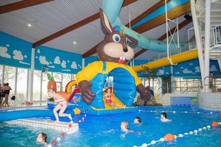 play cushion in the water of the swimming pool of the Roompot Buitenhof Domburg holiday park