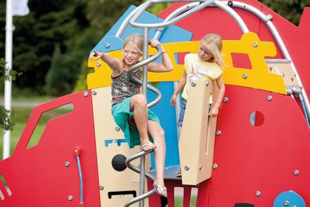 Children play in the playground of holiday park Roompot Buitenplaats De Hildenberg