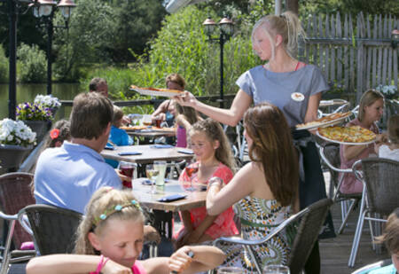 People on the terrace of the eatery at the Roompot Cape Helius holiday park