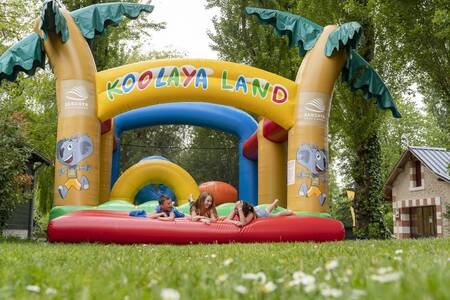 Children on the bouncy castle at the Roompot Château des Marais holiday park