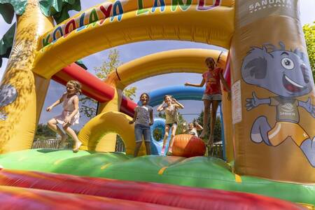 Children jump on the bouncy castle at the Roompot Côte de Nacre holiday park