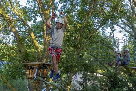 Children climb at the Roompot Côte de Nacre holiday park