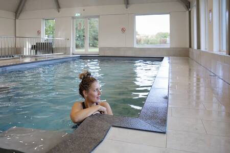 A woman swims in the indoor pool of the Roompot De Heihorsten holiday park