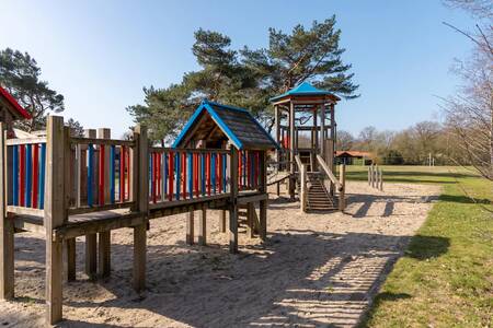 Playground with wooden play equipment at the Roompot De Veluwse Hoevegaerde holiday park