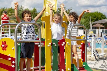 Children play in a playground at the Roompot Deux Fontaines holiday park