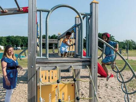 Children play in the playground at the Roompot Duinresort Dunimar holiday park