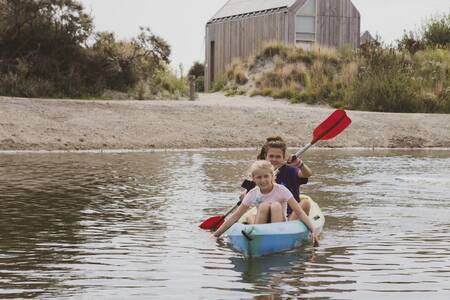 People canoeing in the water at the Roompot ECO Grevelingenstrand holiday park