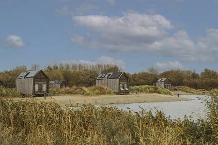 A few ECO Cottages on the water at the Roompot ECO Grevelingenstrand holiday park