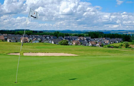 Golf course with Roompot Ferienresort Cochem . in the background