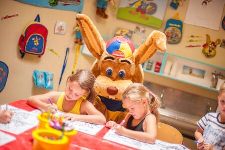Children and Koos coloring rabbit at the kids club at Roompot Ferienresort Cochem