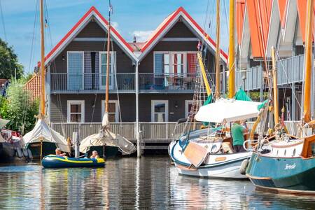 Boats in the marina and holiday homes at Roompot Havenresort Terherne