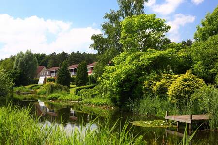 Holiday homes and a jetty on the water at Roompot Holiday Park Emslandermeer