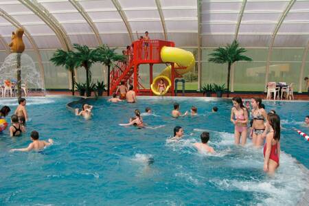 People swim in the pool at Roompot Holiday Park Herperduin