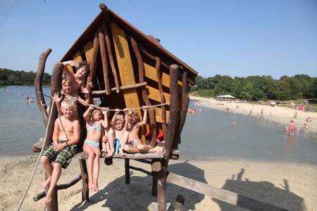 Children on a playground on the beach at Roompot Holiday Park Hunzedal