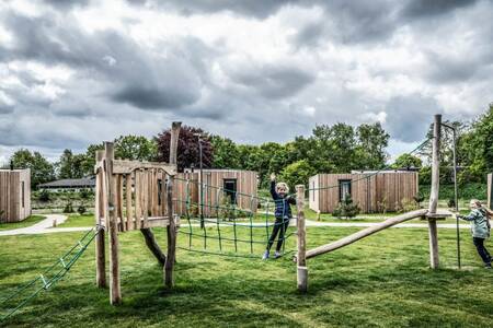 Children play in a playground at Roompot Holiday Park Schaijk