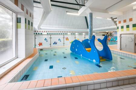 Toddler pool with slide in the swimming pool of the Roompot Landgoed Het Grote Zand holiday park