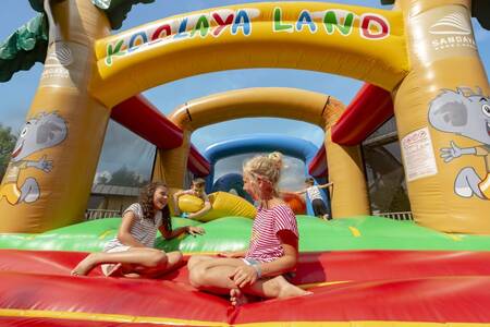 children play on a bouncy castle at the Roompot Le Ranolien holiday park