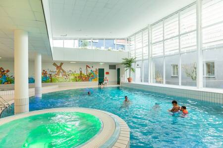 People swimming in the indoor pool of holiday park Roompot Marinapark Volendam