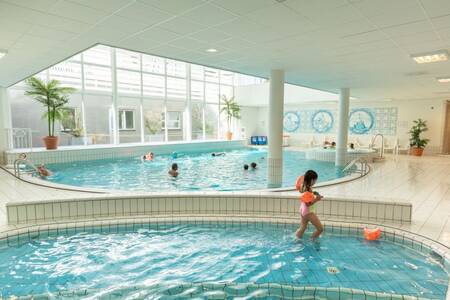 Child plays in the paddling pool of the Roompot Marinapark Volendam holiday park