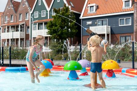 2 Children in the water playground at the Roompot Marinapark Volendam holiday park