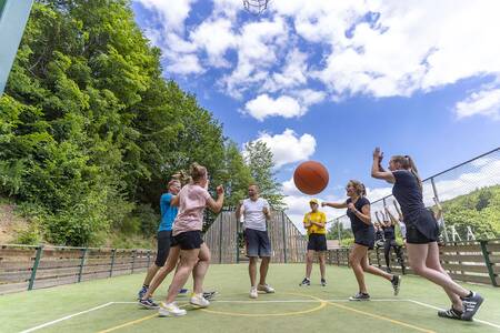 People on the multifunctional playing field of the Roompot Parc la Clusure holiday park